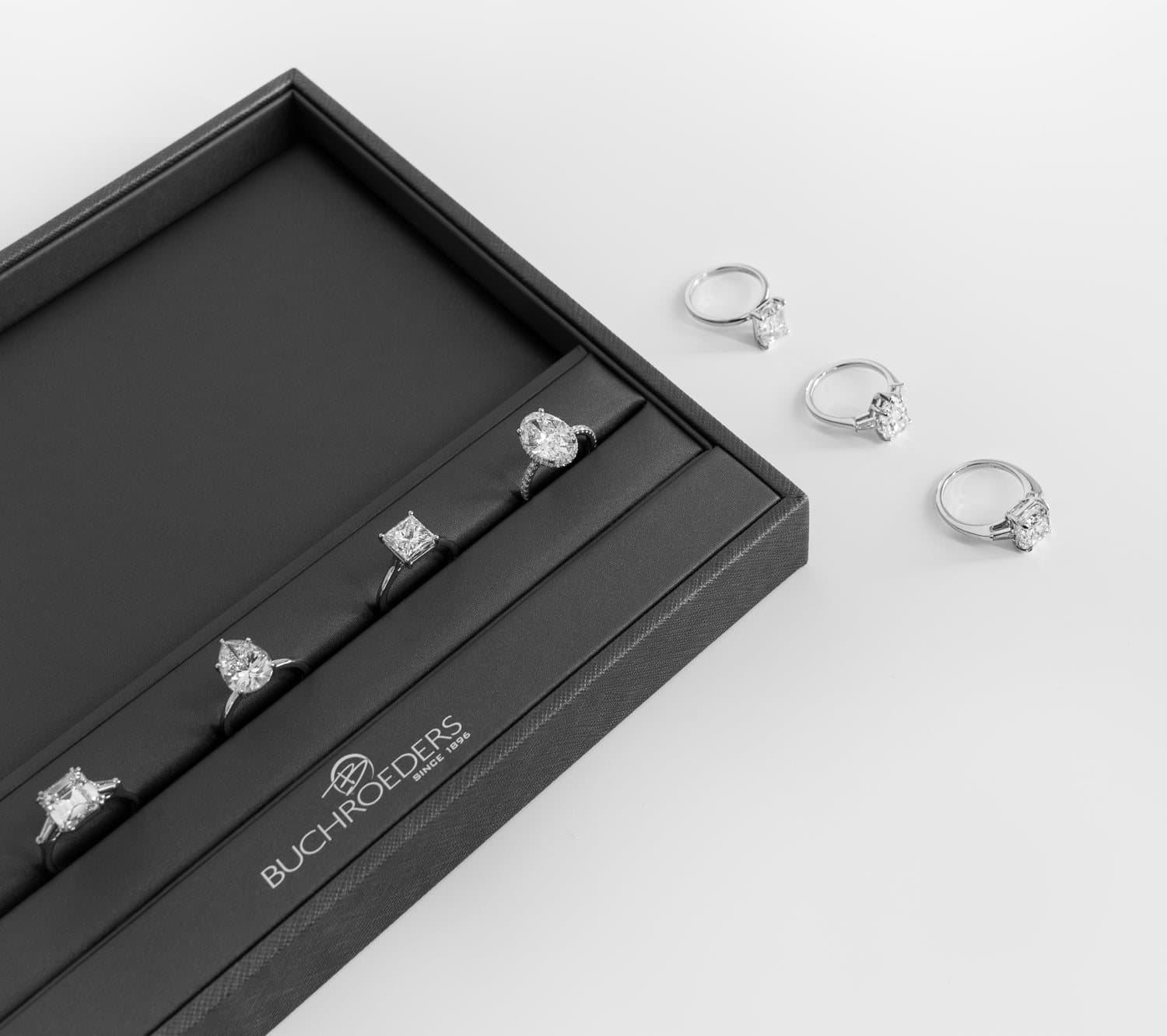 A selection of loose and set diamonds photographed in close detail
